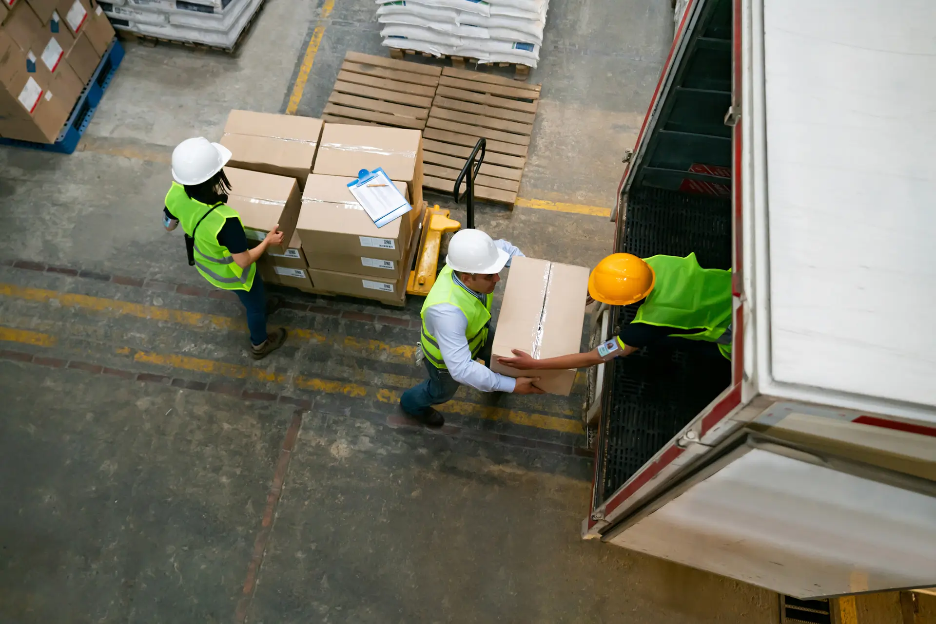 men loading boxes into truck