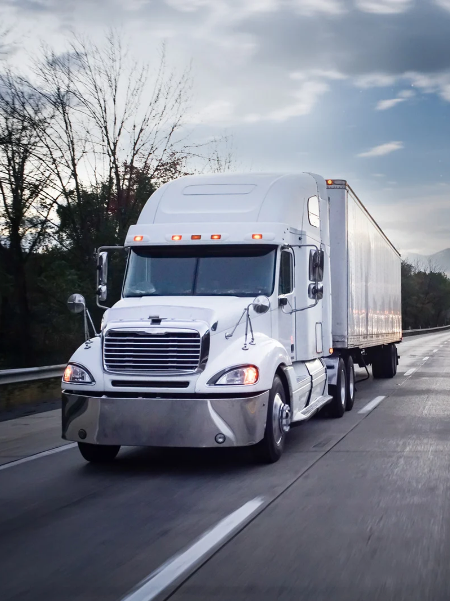 18 wheeler on the road in the evening hours